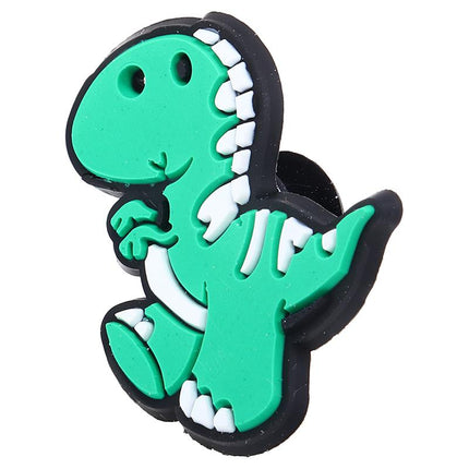 Green dinosaur shoe charm with black and white textured details