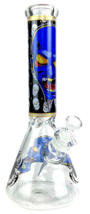 Glass water beaker with blue monster artwork, skull motifs, chrome top ring.