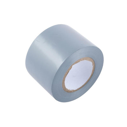 Grey duct tape roll close-up, adhesive backing visible on inner core