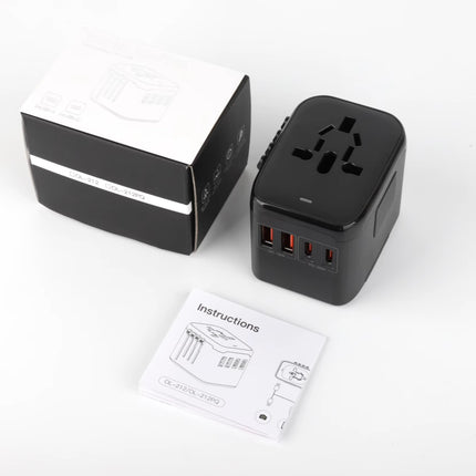 Black travel adapter with multi-outlet ports and USB ports, with instruction sheet