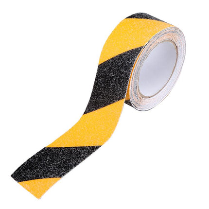 Yellow and black striped anti-slip hazard grip tape, coarse grit roll end view