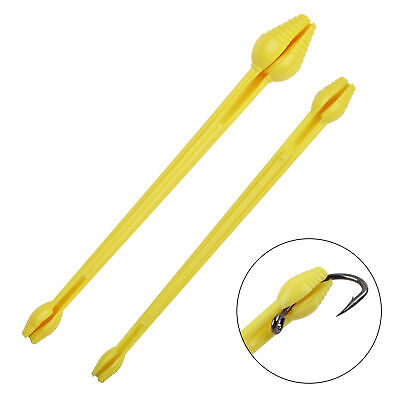 Yellow plastic hook remover tool with twin curved prongs