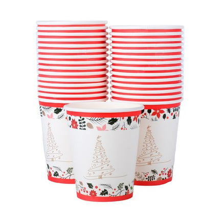 Set of paper cups stacked, white with red striped bands and Christmas tree patterns