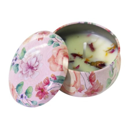 Floral votive soy candle in decorated tin, lid open to show wick and wax