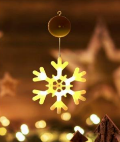 Hanging yellow snowflake light decoration with metal star cutouts