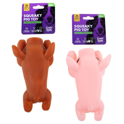 Squeaky pig dog toy in orange and pink plush, shown with retail packaging cards