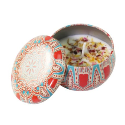 Rose soy scented candle in decorative votive tin with patterned lid, top view
