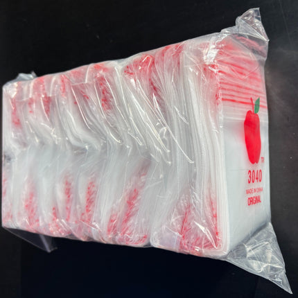 Bundle of 100mm x 75mm zip-top storage bags with apple logo, red 3040R
