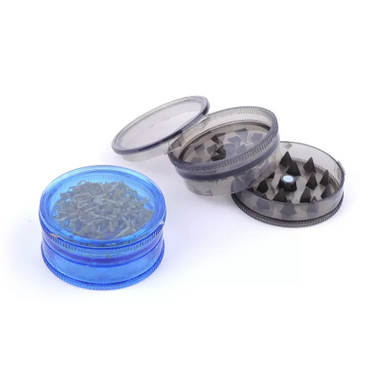 Herb grinder with metal teeth and clear top lid, blue and silver grinder pieces