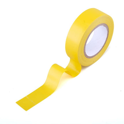 Yellow electrical insulation tape roll with adhesive backing and cut edge