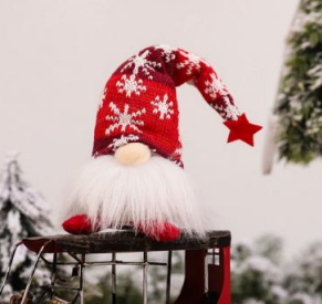 Red Christmas gnome ornament with knit hat, white beard, and star charm