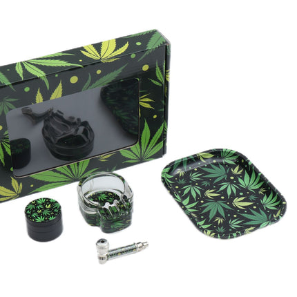 4-piece smoke kit with leaf-pattern box, black grinder, jar, and metal smoking tools