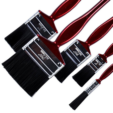Assorted paint brushes close-up: black bristles on red handles