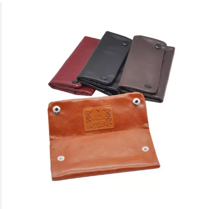 Leatherette tobacco pouch in orange and dark colors, with metal snap buttons