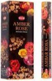 Narrow incense sticks box with amber rose and gold fleck illustrations on dark floral art
