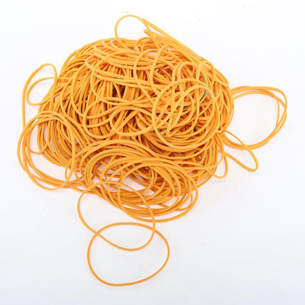 Yellow rubber band loops, coiled heap of elastic bands