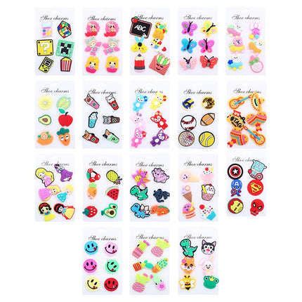 Assorted shoe charm set on cards, featuring colorful animals, letters, and objects