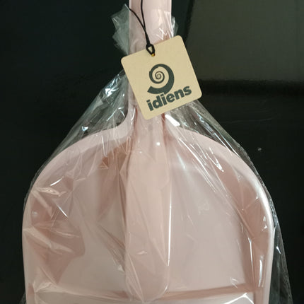 Light pink dustpan and brush set sealed in clear plastic packaging