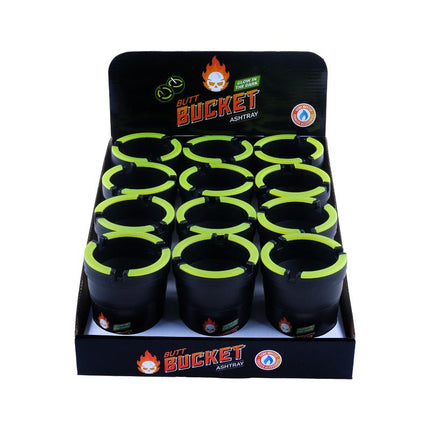 Glow-in-the-dark ashtray bucket with neon green openings, shown in retail box