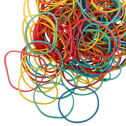 Assorted rubber bands in red, yellow, blue, and green loose pile