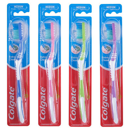 Medium toothbrushes in blue blister packs labeled Extra Clean with colored bristles