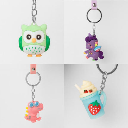 Assorted novelty animal keychain charms on silver rings, including owl, cat, and octopus