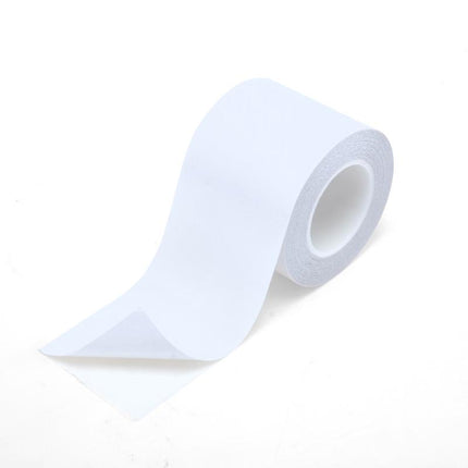 Double-sided mounting tape roll with white adhesive strip, semi-transparent backing