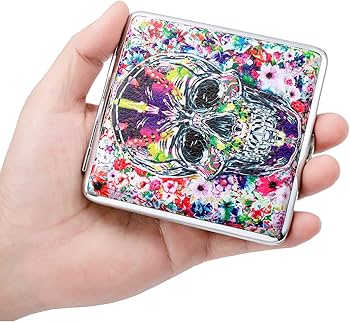 Metal cigarette case with colorful skull-and-floral graphic, hinged lid