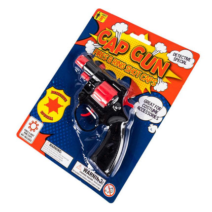 Angled black cap gun toy blister pack with red barrel, detective special badge.