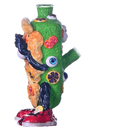 Cartoon pizza-themed glass water pipe from rear angle with green body and blue accents.