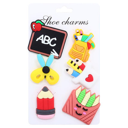 Set of 6 colorful shoe charms, including ABC chalkboard, flower, and pencil