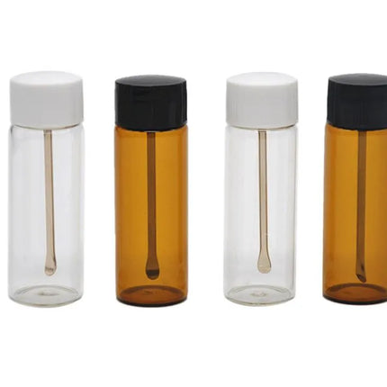 Clear and amber glass spice canisters with white/black lids and spoon inserts (set)