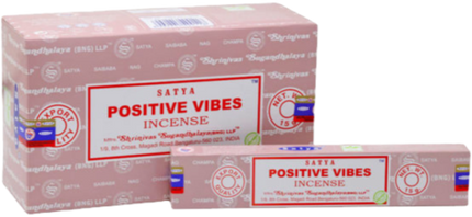 Satya Positive Vibes incense boxes, pink with red label and blue seal corners