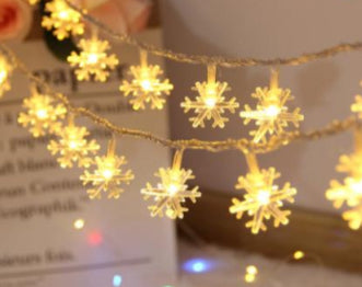 Warm-white LED snowflake string lights with hanging snowflake bulbs on thin wire