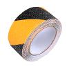 Yellow and black striped anti-slip grip tape strip wound on roll, coarse grit