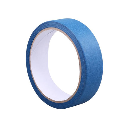 Blue masking tape roll, 2.5 cm width, adhesive paper backing visible