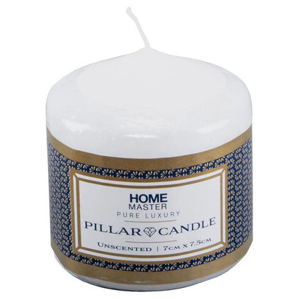 White unscented pillar candle with blue patterned label and gold band, close view