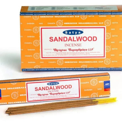 Satya sandalwood incense sticks in rectangular orange box, with several rolled sticks