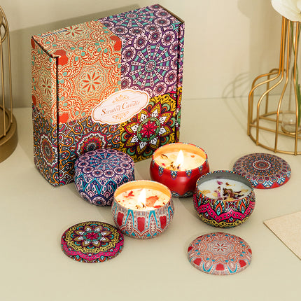 Flame-lit soy candle tin in decorative gift box with 4 patterned tins