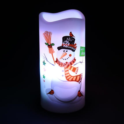 Rotating projector candle with blue-lit snowman design on translucent cylinder