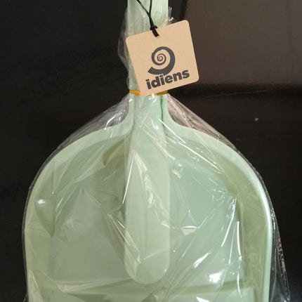 Light green dustpan and brush set sealed in clear plastic packaging