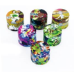 Multi-pack of small round character alloy herb grinders with bright graphic tops