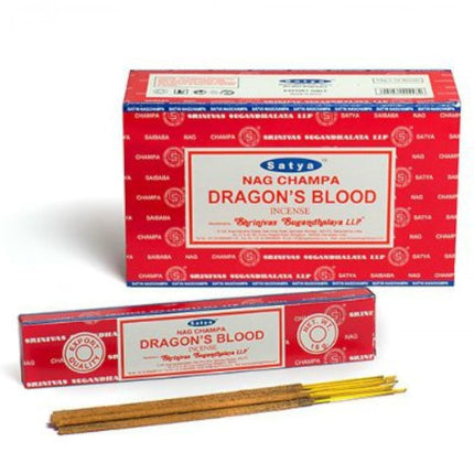 Red incense box with Satya Dragon's Blood label and several incense sticks