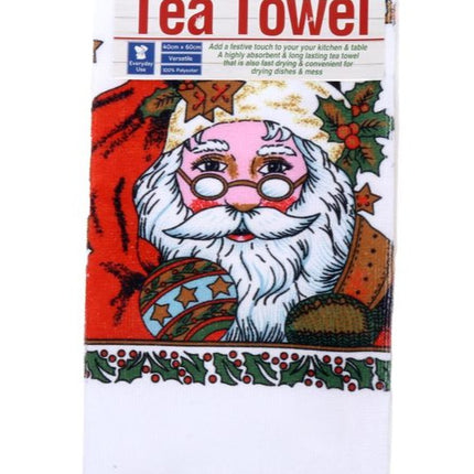 Christmas tea towel with Santa face design, red and white with holly border.