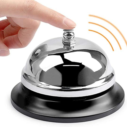Shiny metal reception bell with chrome dome and black base, metal push top.