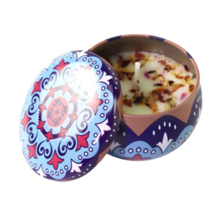 Vanilla scented votive candle in purple patterned metal tin, open lid
