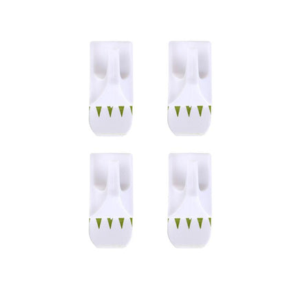 Four white plastic adhesive hooks with green arrow grips on backing