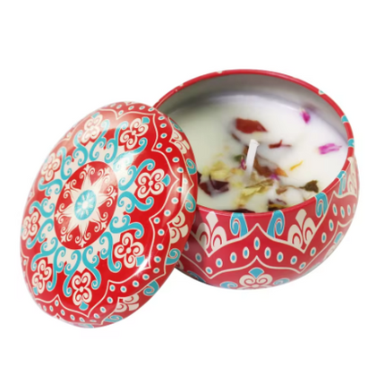 Patterned votive tin soy candle, open lid; white wax with flower petals inside