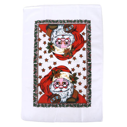 Christmas tea towel featuring two Santa portraits, red star background with holly border.