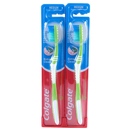 Two medium Extra Clean toothbrushes in blue blister packaging with colored bristles